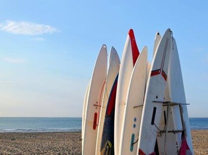 Rapid cure laminating system for the surfboard market